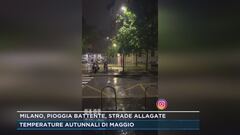 Milano, pioggia battente, strade allagate